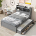 Gray Giga full size platform bed with trundle, built-in shelves, drawers, and USB ports shown in a modern bedroom setting.
