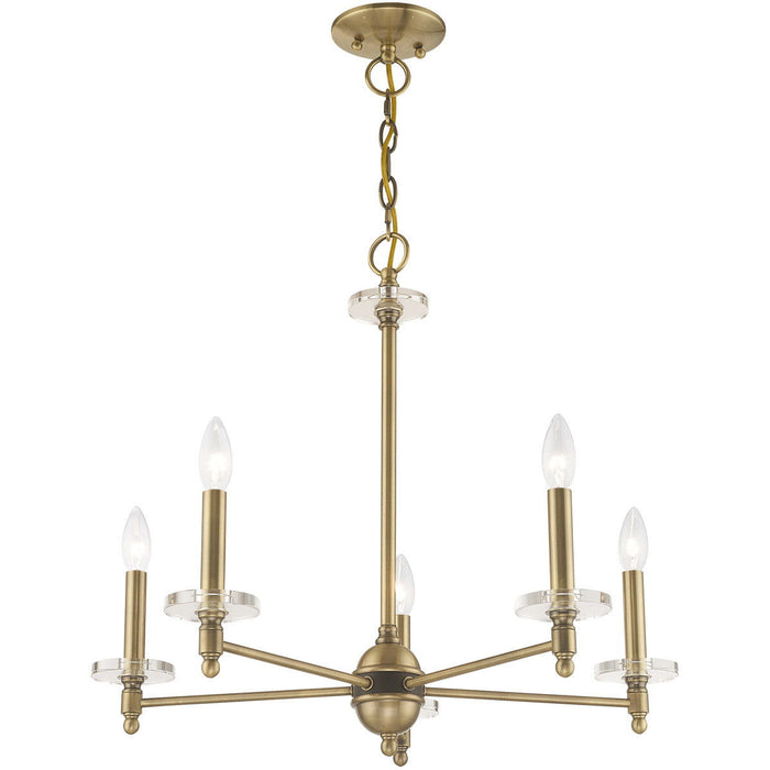 HomeRoots five-light metal chandelier with shades in antiqued brass finish and clear glass, dimmable for adjustable lighting.