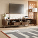 Giga walnut TV stand for TVs up to 85 inches with soft-close doors, open shelf, and cable management system.