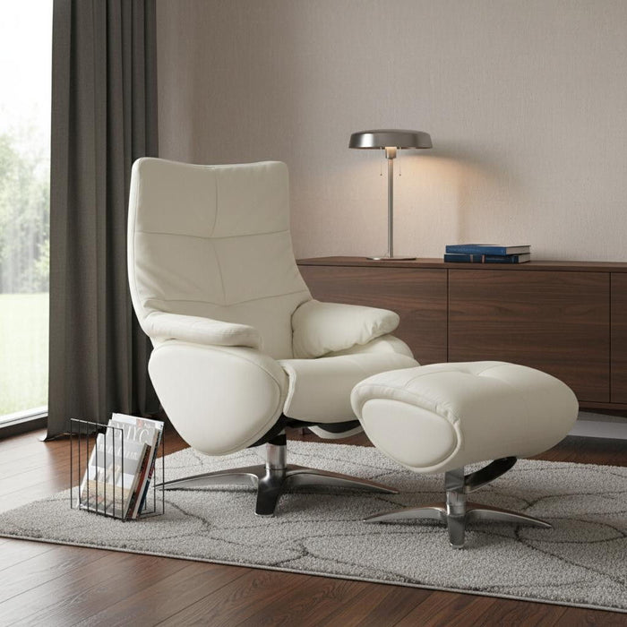 White genuine leather HomeRoots tufted manual swivel recliner with matching ottoman, showcasing plush upholstery and modern design.