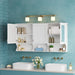 White Giga wall-mounted medicine cabinet with adjustable shelf, open shelves, and mirror for bathroom storage over toilet.