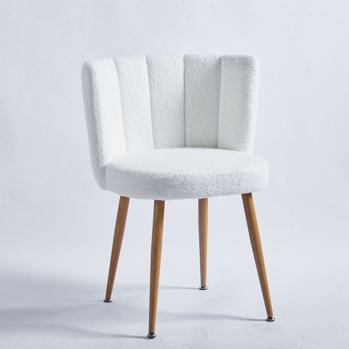 Pair of Giga modern dining chairs with wood-colored iron tube legs, shorthair cushions, and ergonomic backrests.