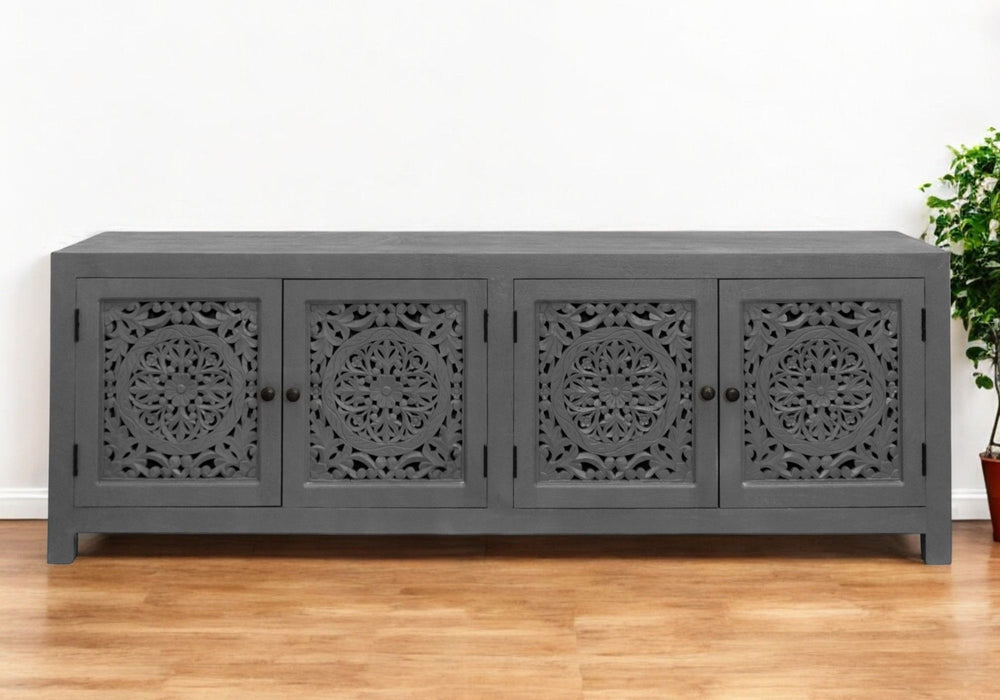 Dark gray 86-inch carved floral distressed solid wood TV stand with enclosed storage from HomeRoots, perfect for modern living rooms.
