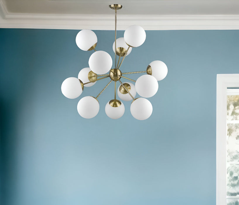 HomeRoots Sputnik twelve-light chandelier with frosted metal finish, white shades, and brass accents, dimmable for modern lighting.