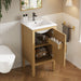 Natural wood Giga bathroom vanity cabinet with sink, adjustable shelf, and soft closing hinges, ideal for modern bathroom storage.