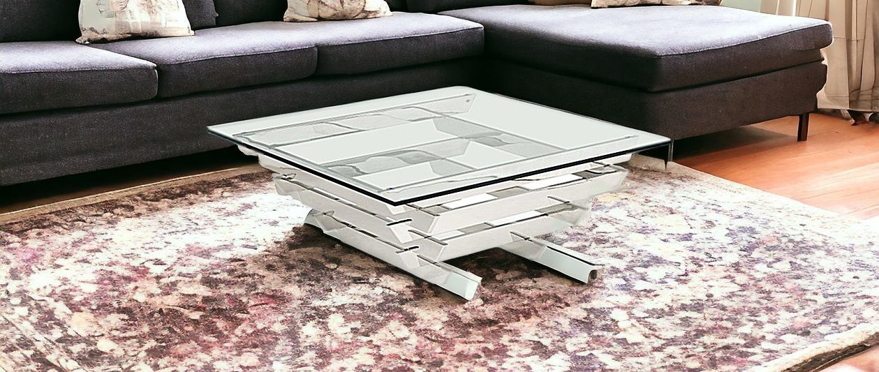Glass and stainless steel square coffee table with shelf, clear glass top and silver frame, modern design by HomeRoots.