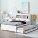 Giga full size white platform bed with trundle, built-in drawers, USB ports, and shelves, shown in a modern bedroom setting.