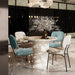 Modern Giga 5-piece dining set with white table, turquoise chairs, bamboo accents, metal legs, space-saving design for dining room.