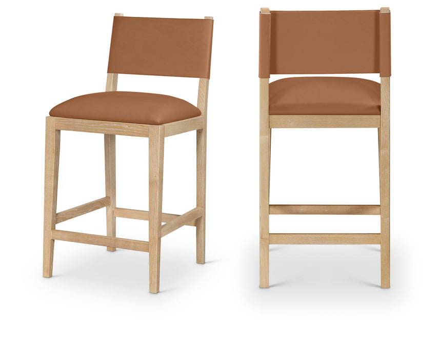 Meridian Furniture Avon vegan leather counter stool with 24-27 inch height, featuring a modern design and wooden legs.