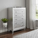 HomeRoots champagne accent chest with tapered acrylic legs and five drawers, showcasing a stylish storage piece.