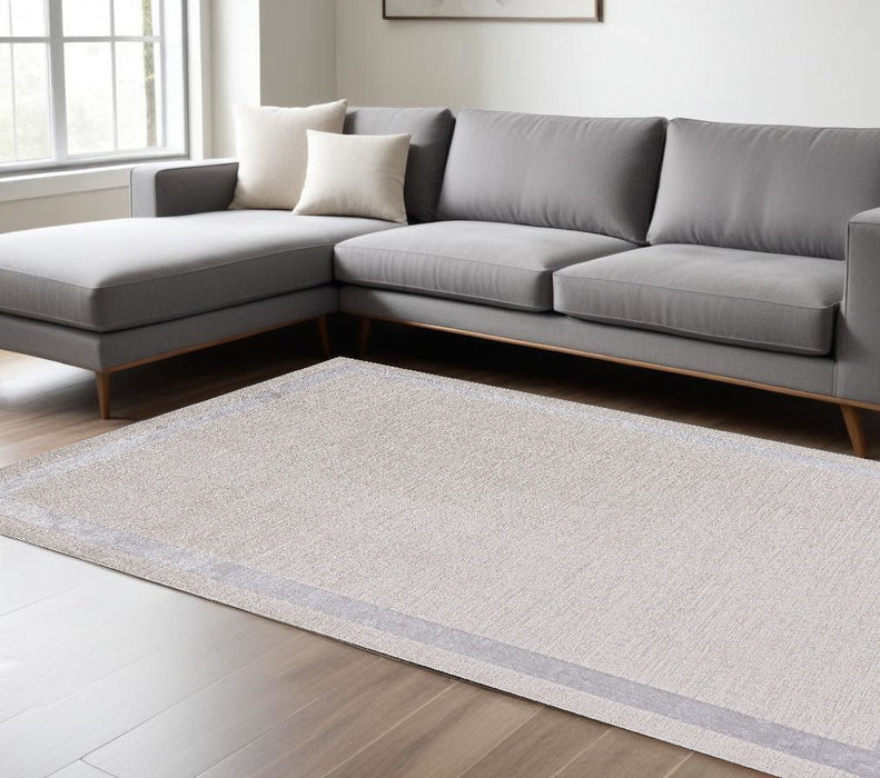 7' x 10' Machine Woven Bordered Indoor Area Rug - Ivory Silver