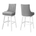 Set of two gray and white 29-inch faux leather and solid wood swivel bar height chairs by HomeRoots, featuring modern design.