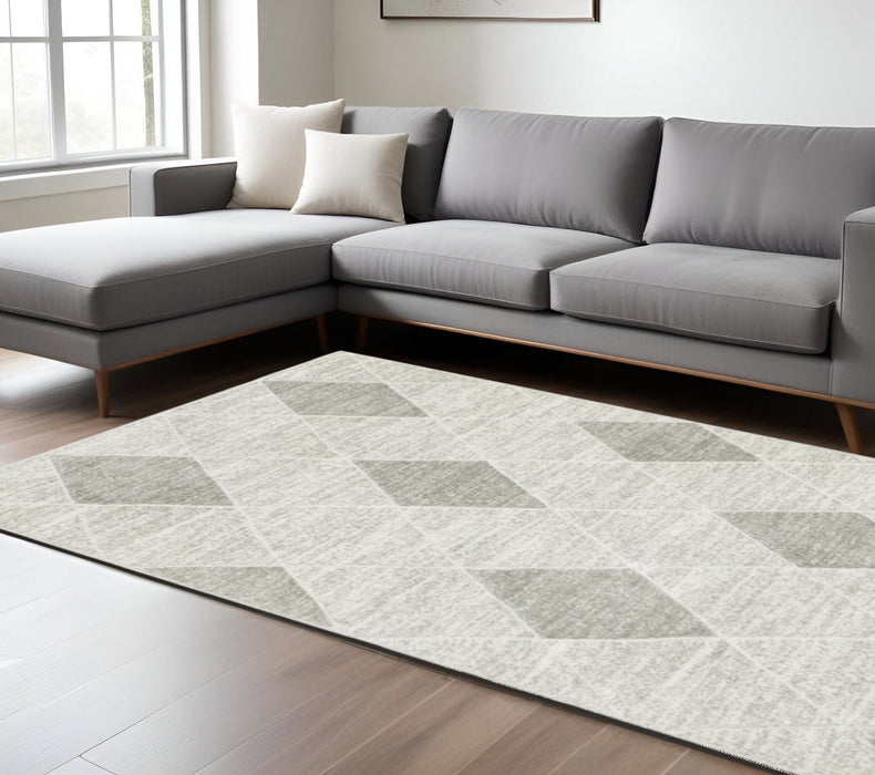 6' x 9' Geometric Power Loom Stain Resistant Area Rug - Gray And Ivory