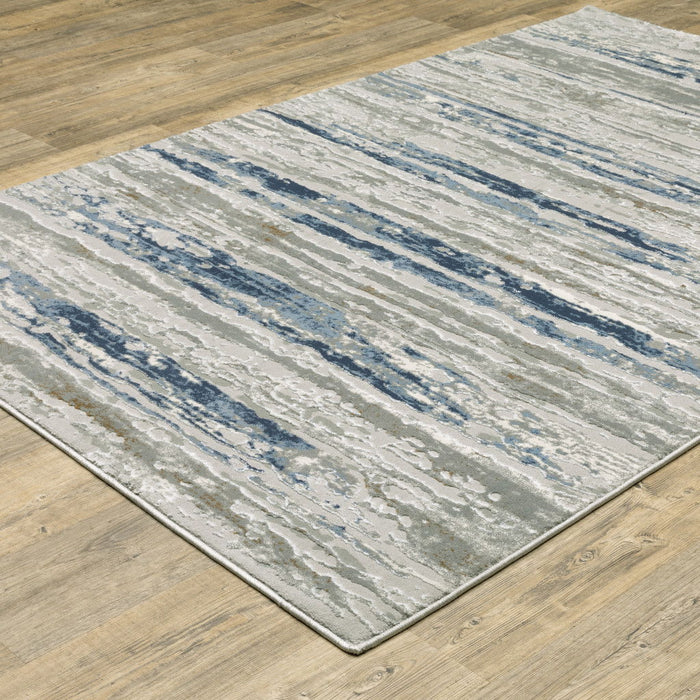 6' x 9' Abstract Power Loom Stain Resistant Area Rug - Blue Ivory Gray Light Blue And Brown