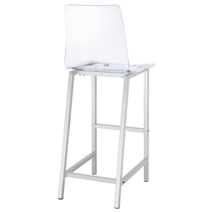Set of two Juelia Clear Acrylic Bar Chairs with chrome legs, showcasing sleek, modern furniture design on a neutral background.