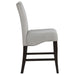 Set of two CoasterEssence Stanton velvet upholstered counter chairs in grey with plush, tufted seats and sleek wooden legs.