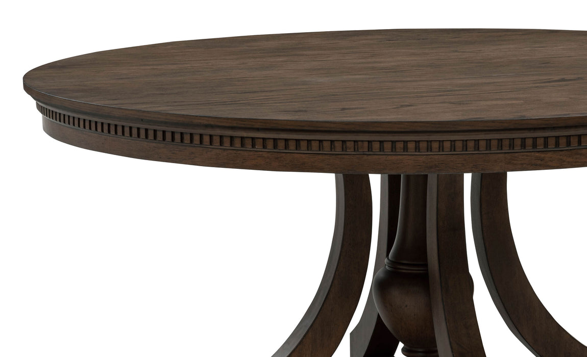 Dark oak Ridgewell round pedestal dining table by CoasterEveryday with a sturdy wooden design and smooth tabletop surface.