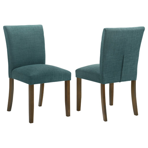 Set of two teal blue upholstered CoasterEveryday Paxton dining side chairs with wooden legs and cushioned seats.