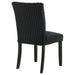 Pair of CoasterEveryday Dermott black upholstered Parson dining side chairs with cushioned seats and sleek design.