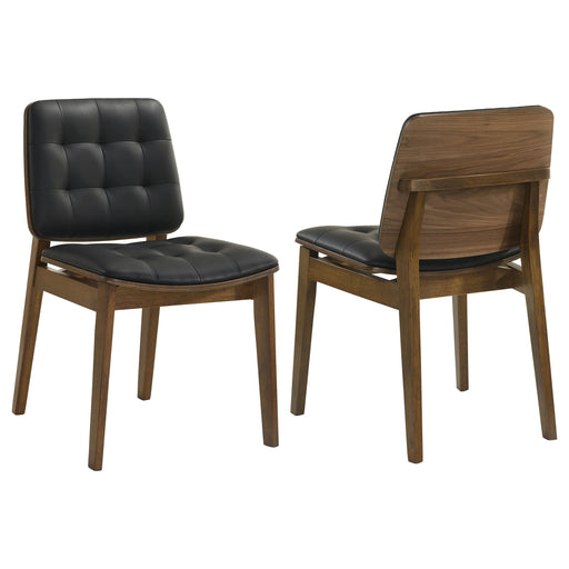 Pair of CoasterEssence Redbridge faux leather dining side chairs with walnut wood legs, showcasing sleek modern furniture design.