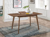 Alfredo 63-inch extension leaf dining table in natural walnut wood, showing the polished surface and sturdy legs.