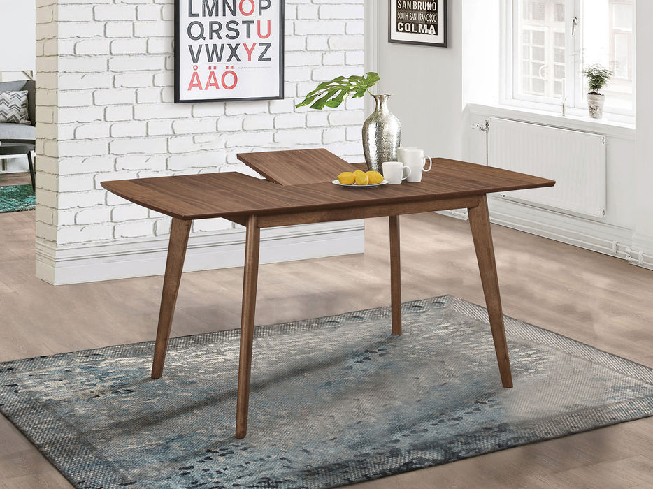 Alfredo 63-inch extension leaf dining table in natural walnut wood, showing the polished surface and sturdy legs.