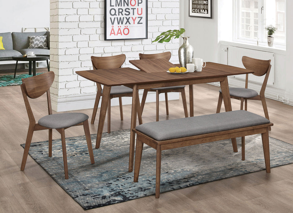 Natural walnut Alfredo 63-inch extension leaf dining table by CoasterEveryday, showing the tabletop with extended leaves and sturdy legs.