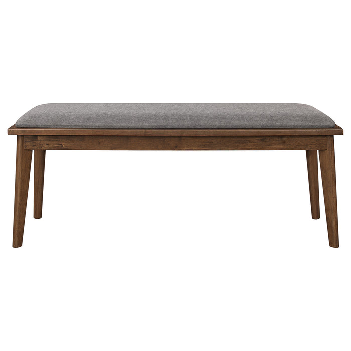 Alfredo upholstered dining bench in grey and natural walnut wood, showcasing its modern design and cushioned seating.