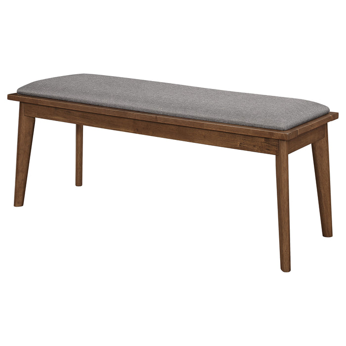 Alfredo upholstered dining bench in grey and natural walnut wood with cushioned seat and wooden legs, designed for kitchen or dining room.