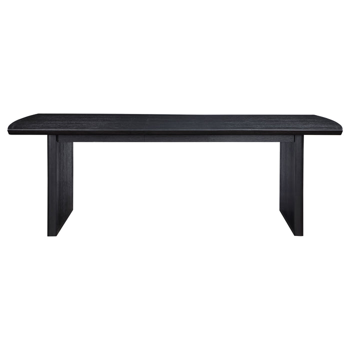 Brookmead 100-inch black extension leaf dining table by CoasterEssence, showing a sleek black wooden surface with extension leaves.
