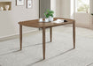 Dortch 63-inch oval walnut rubberwood dining table with tapered legs, showcasing smooth surface and elegant design in a furniture image.