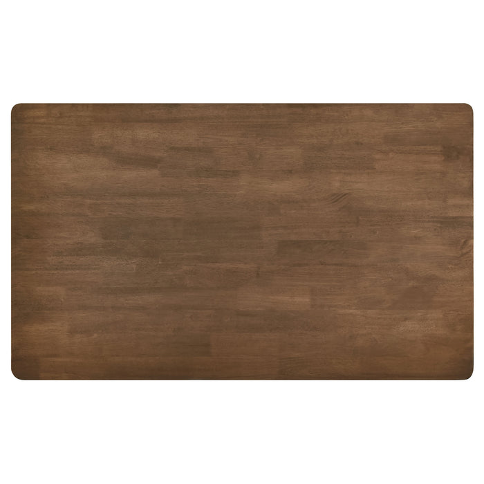 CoasterEveryday Parkridge 59-inch rectangular dining table in natural walnut wood with sturdy legs and smooth surface.