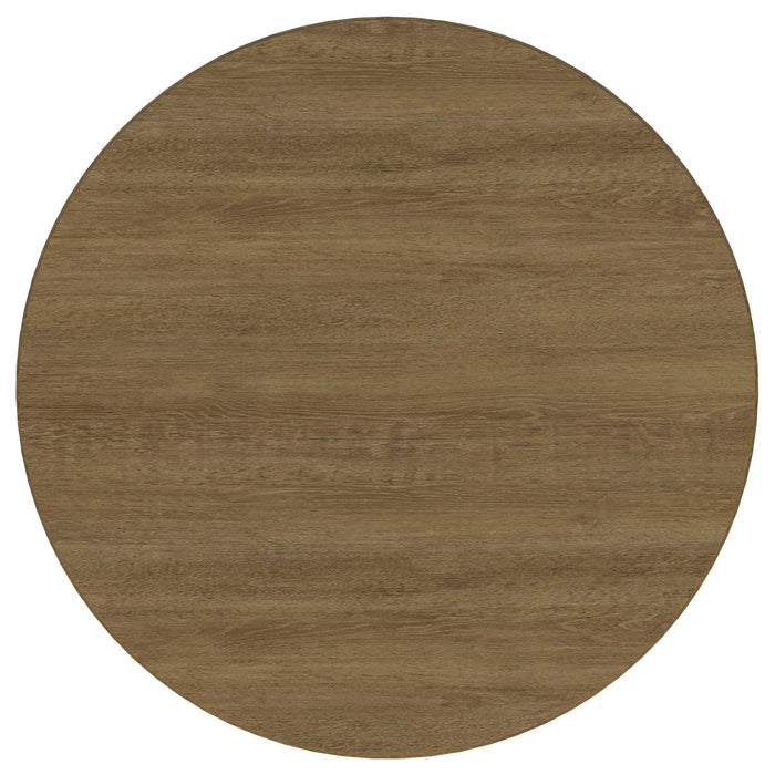 CoasterEveryday Arini 60-inch round wood dining table in sand wash finish, showcasing smooth tabletop and sturdy wooden legs.