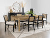 CoasterEveryday Arini 7-piece extension leaf dining table set in sand wash and black with matching chairs and table leaves.
