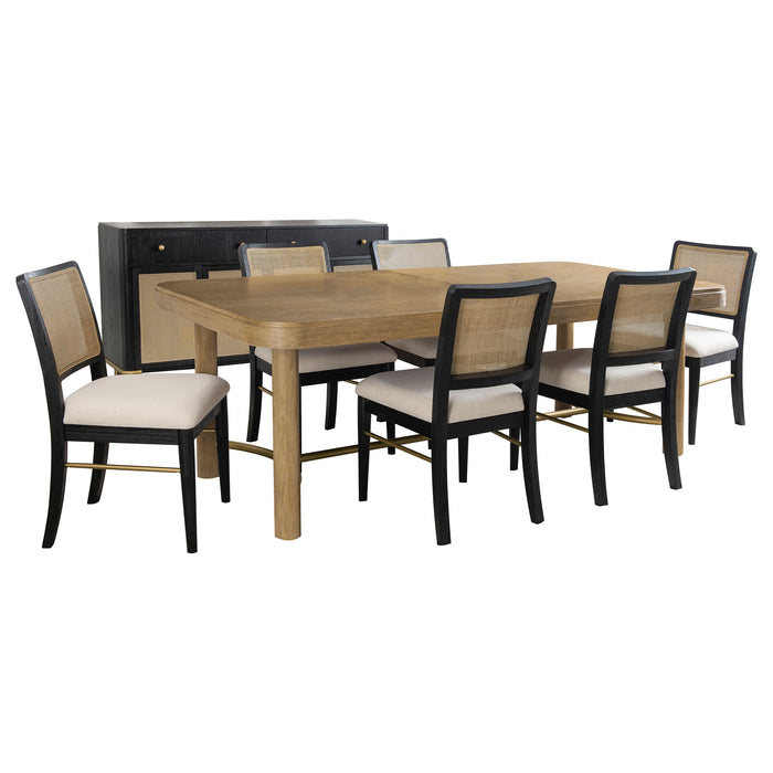 CoasterEveryday Arini 7-piece extension leaf dining table set in sand wash and black, showing the table with extension leaf and chairs.