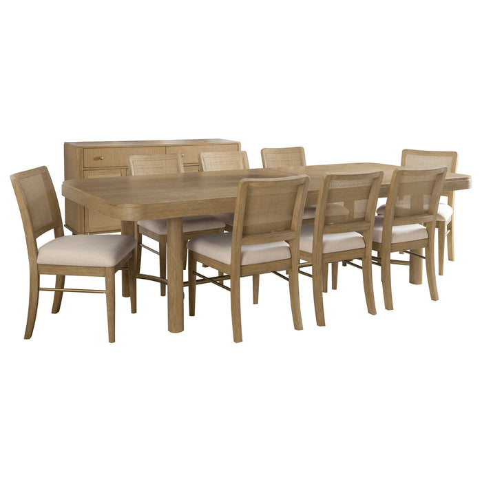CoasterEveryday Arini 9-piece extension leaf dining table set in sand wash finish, showing the table with extended leaf and matching chairs.