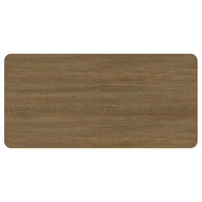 CoasterEveryday Arini 104-inch extension leaf dining table in sand wash finish, showing its spacious, elegant wooden surface.