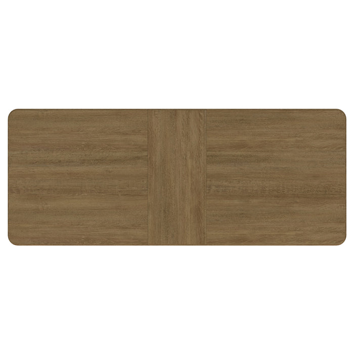 CoasterEveryday Arini 104-inch extension leaf dining table in sand wash finish, showing the spacious wood surface and extended leaves.
