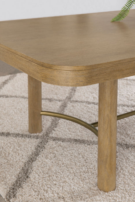 CoasterEveryday Arini 104-inch extension leaf dining table in sand wash finish, showcasing the sleek wooden surface and extended length.