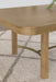 CoasterEveryday Arini 104-inch extension leaf dining table in sand wash finish, showcasing the sleek wooden surface and extended length.