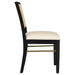 Set of two black Arini rattan cane dining side chairs with woven seats and curved backrests, modern furniture by CoasterEveryday.