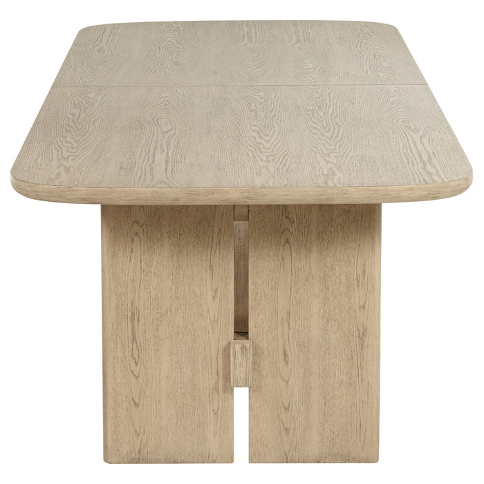 Kailani 110-inch rectangular wood dining table in beige oak with sturdy legs, ideal for large dining rooms and family gatherings.