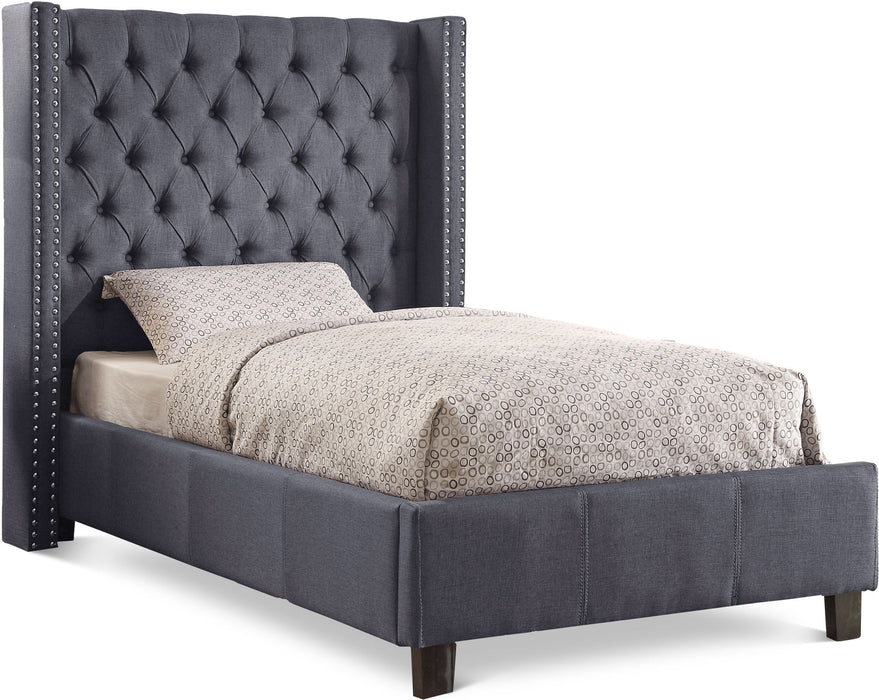 Upholstered Ashton bed by Meridian Furniture featuring a padded headboard and modern design in a cozy bedroom setting.