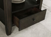Dark cocoa Twyla 60-inch round dining table with built-in drawer, showcasing smooth wooden surface and sturdy legs.