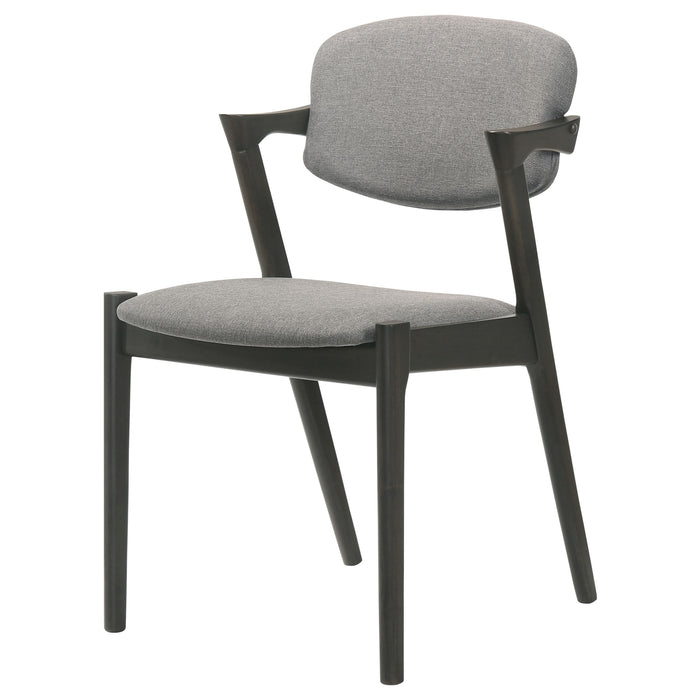 Set of two black CoasterEssence Stevie padded wood dining arm chairs with cushioned seats and armrests.