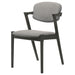 Set of two black CoasterEssence Stevie padded wood dining arm chairs with cushioned seats and armrests.