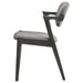 Set of two black Stevie padded wood dining arm chairs by CoasterEssence with cushioned seats and armrests, modern furniture for dining rooms.