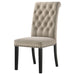 Set of two CoasterEssence Alana velvet upholstered dining side chairs in sand color with wooden legs, showcasing elegant, plush seating.