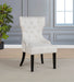Cream and black Baney fabric upholstered dining side chair with wooden legs from CoasterEveryday, shown from a side angle.