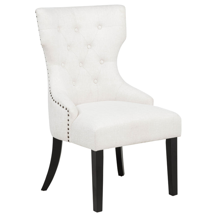 Cream and black fabric upholstered dining side chair from CoasterEveryday with a sleek, modern design and cushioned seat.